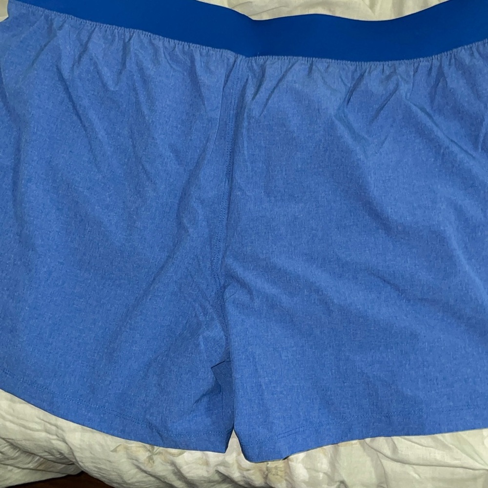 3 mens shorts Under Armor. 1 new with tag and 2 used barely worn.  Black, blue